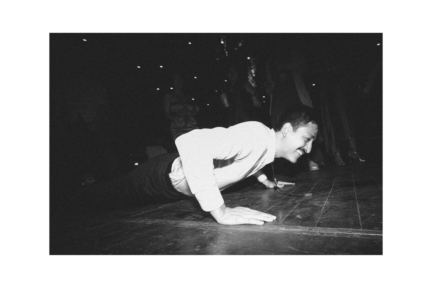 A sequence of black and white dance performance photos showing graceful movements and poses on stage.