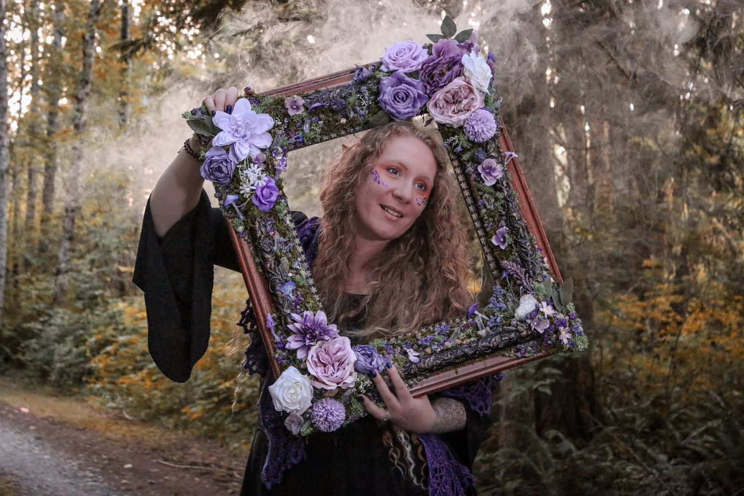 A rustic woodland scene with purple floral accents and vintage decor creates a dreamy autumn atmosphere.