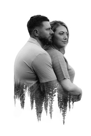 Double exposure romantic couple silhouette with forest reflection creates dreamy artistic portrait against white background.