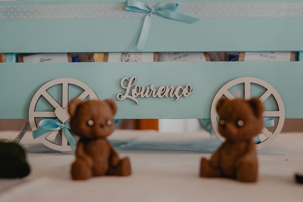Soft blue and brown nursery decor items arranged in a row.
