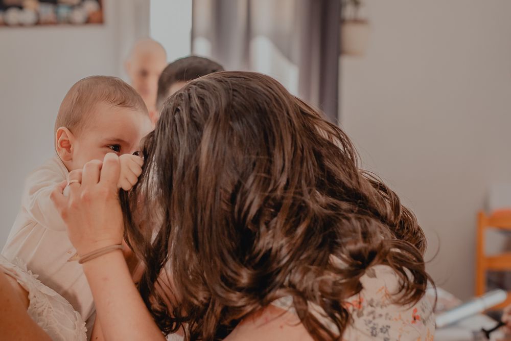 Emotional celebration moment captured in warm indoor lighting.