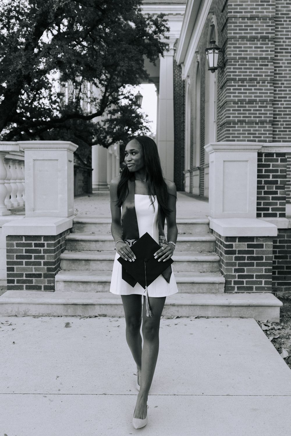 A series of black and white photos showing legs and feet walking down concrete steps near a brick building.