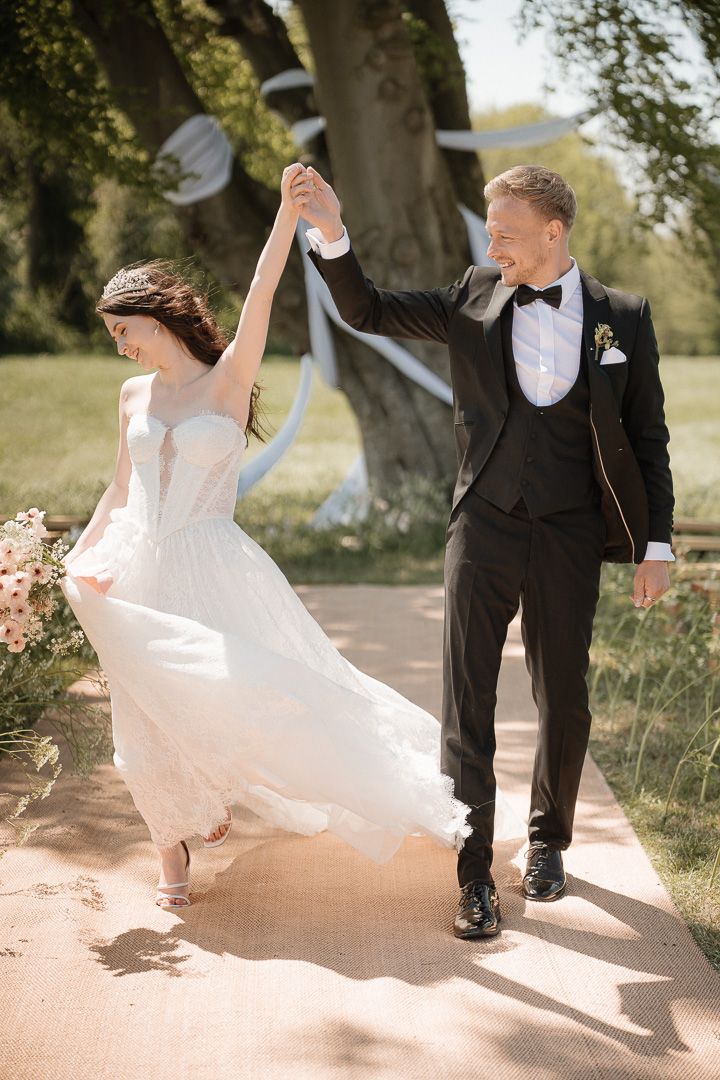 Sequence of dance photos showing bride's flowing white dress twirling during outdoor wedding celebration.
