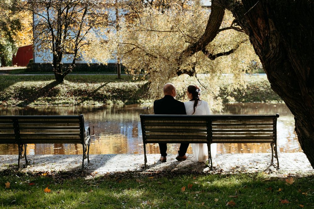 A sequence of winter park scenes with benches, snow-covered paths, and silhouetted figures against a bright background.