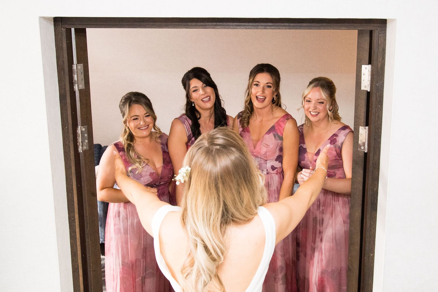 bride facing brides maids