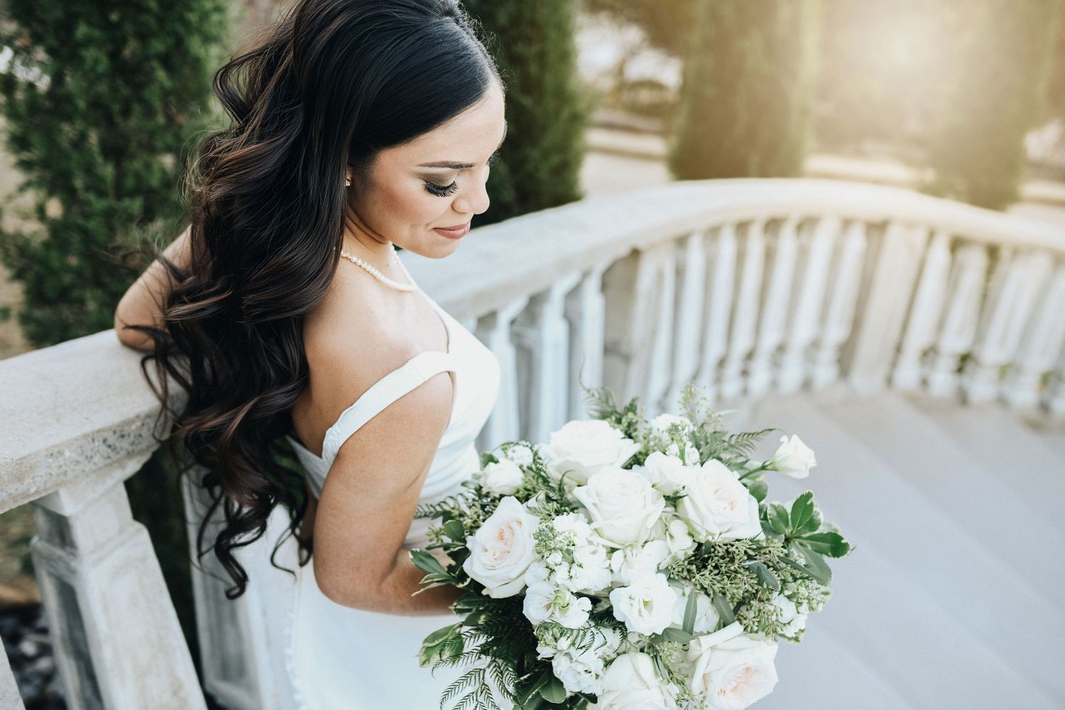 Elegant bride posing on tiled staircase at Stoney Ridge Villa wedding venue in Fort Worth area