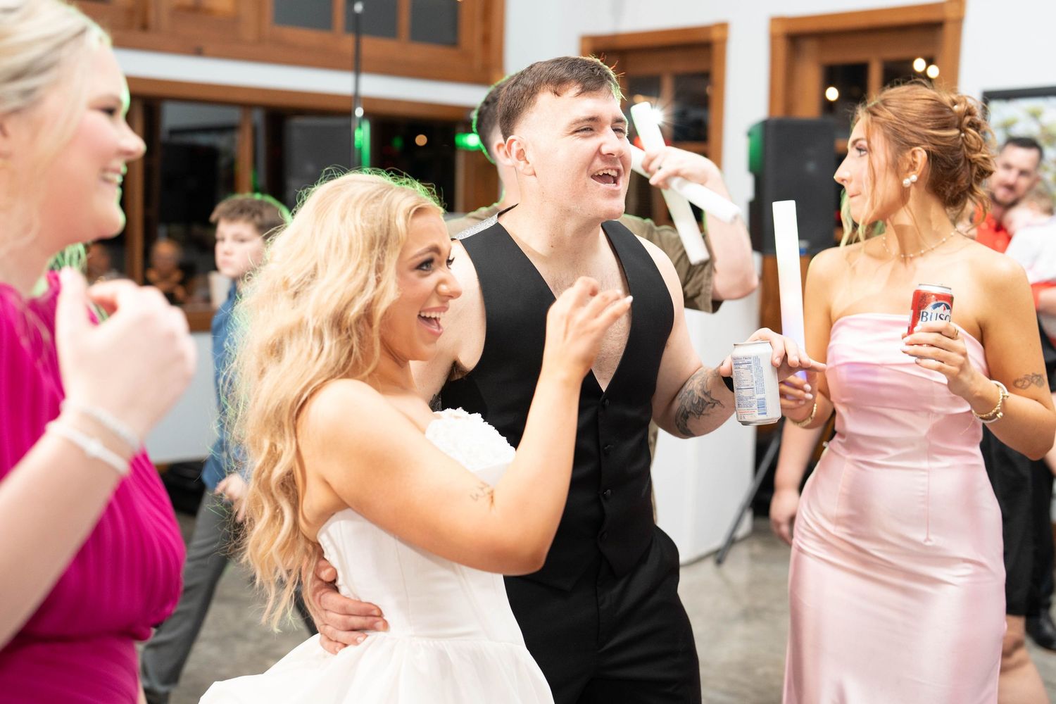 bride and groom laugh at reception
