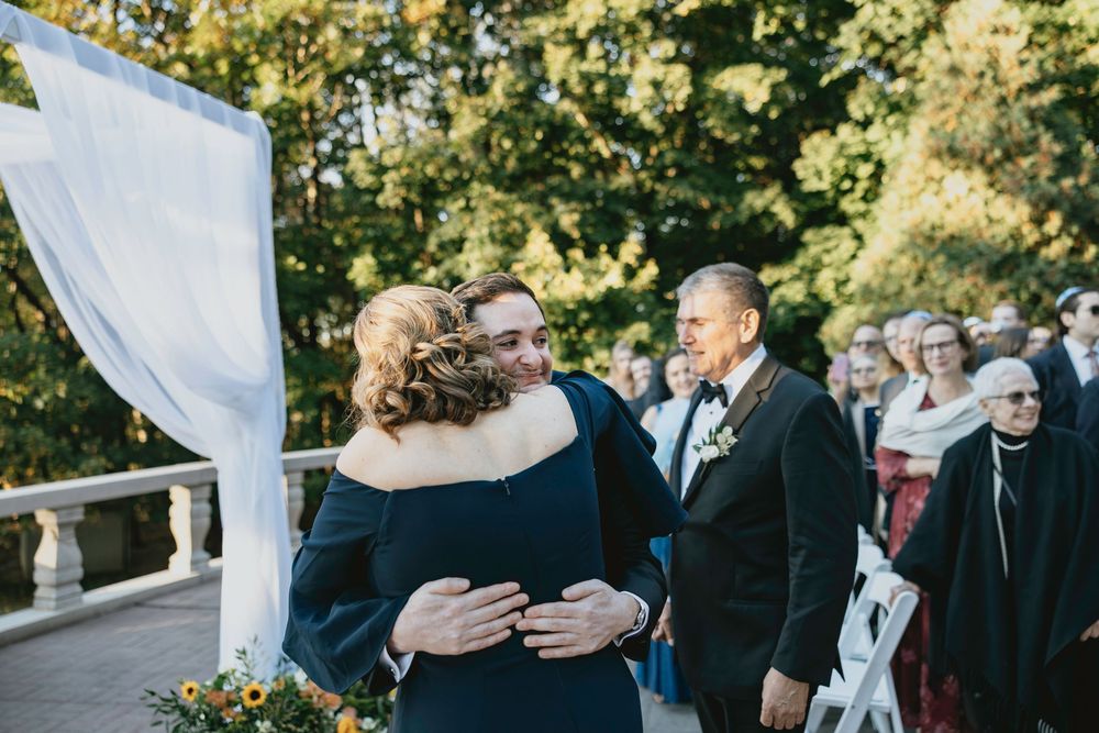 A series of wedding photos showing couples embracing outdoors with white drapes and natural lighting.