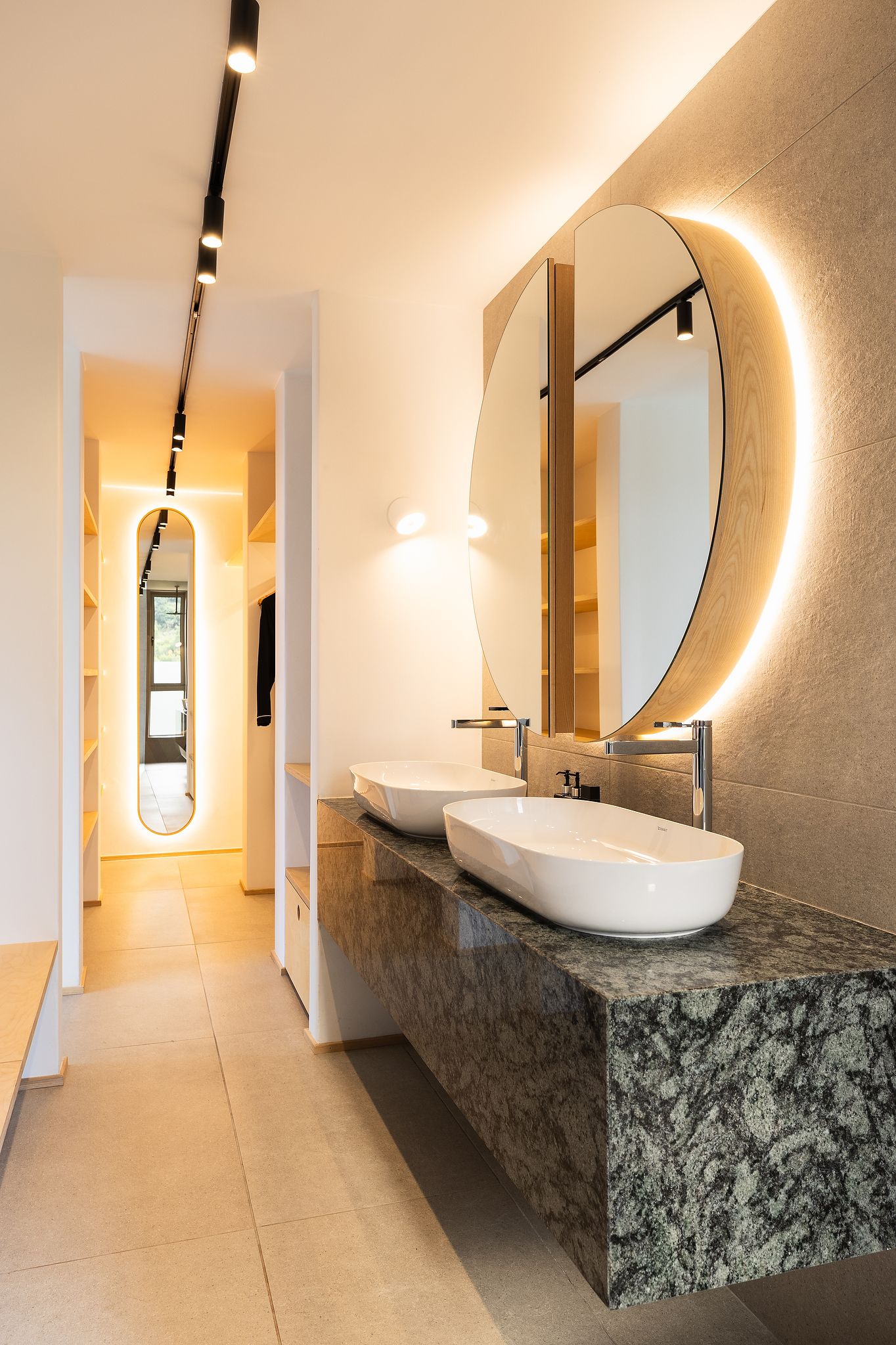 Close-up of natural textures including linen, wood, and stone in a modern home