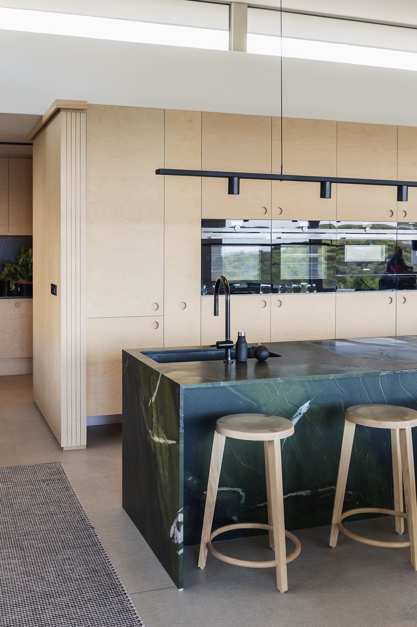Contemporary kitchen interior with warm tones and minimalist design details