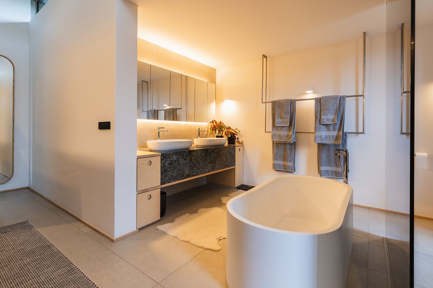 Modern bathroom with clean lines, natural finishes, and soft lighting
