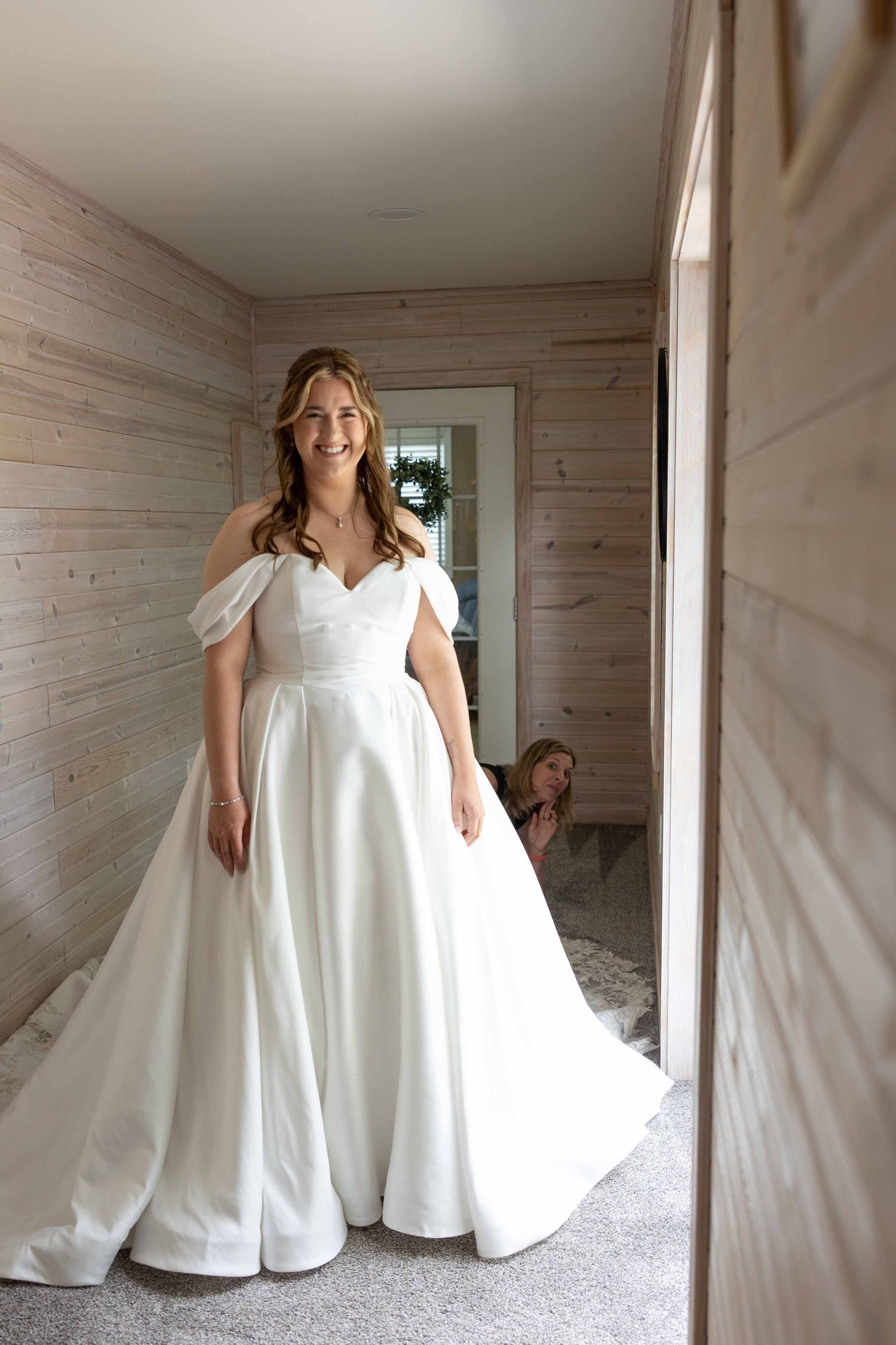 A sequence of photos shows someone twirling in a flowing white wedding dress inside a rustic wooden-paneled room.