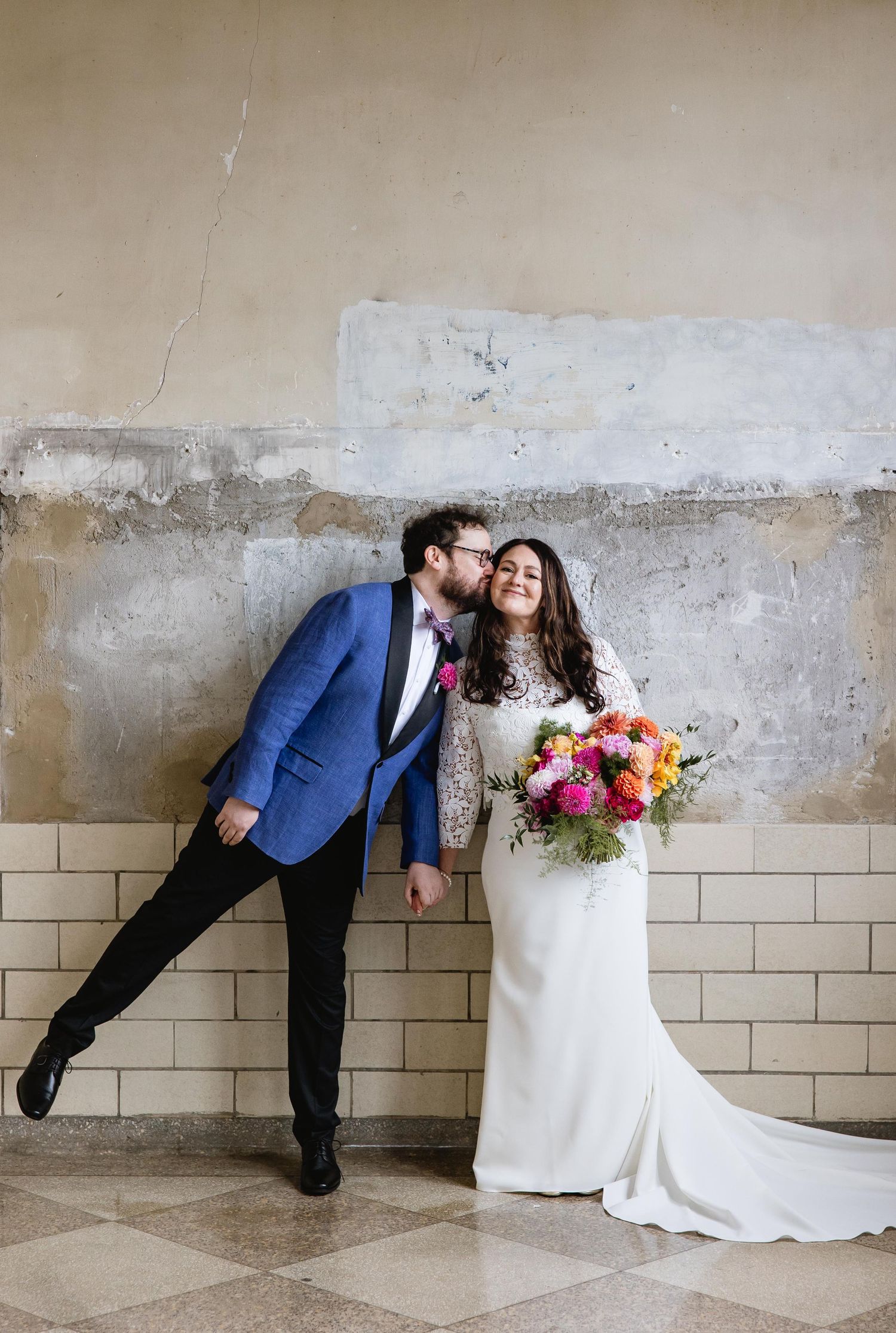 A creative sequence of four wedding photos showing a couple leaning against a rustic wall in playful poses.