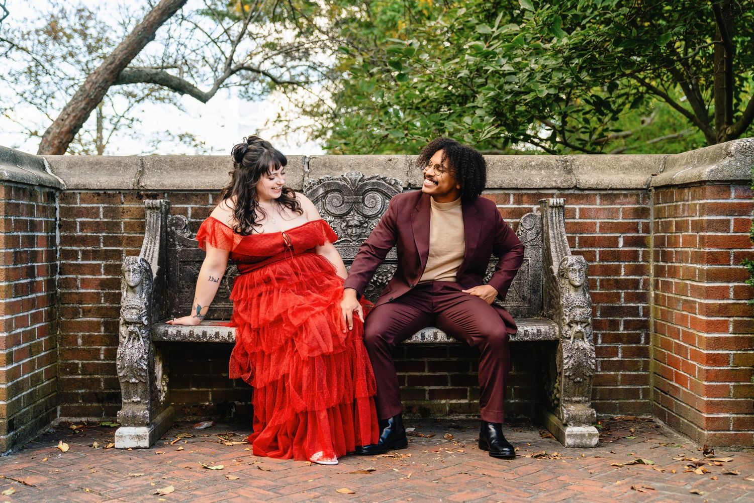 Couple portraits at Lynch Park in Beverly, Massachusetts surrounded by fall foliage.