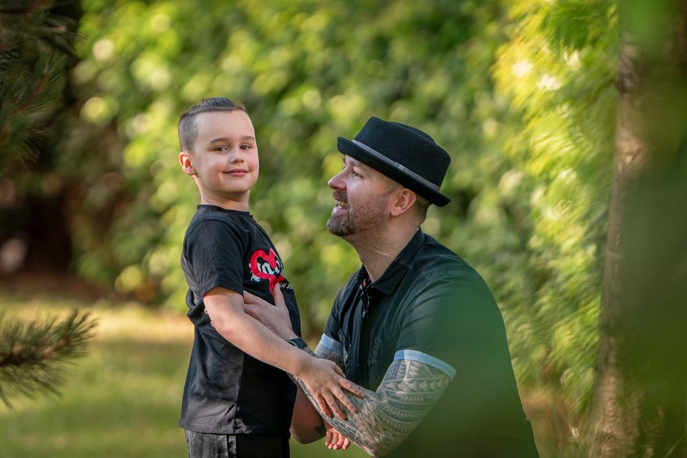 Natural outdoor photography session in a lush green garden setting.