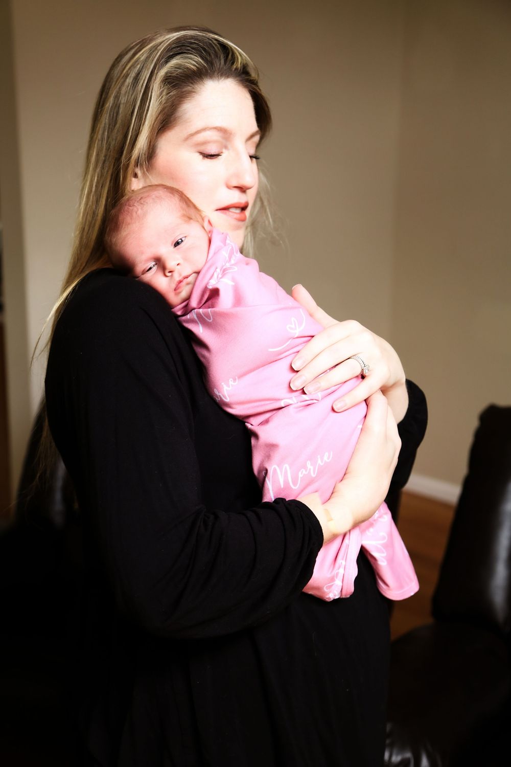 newborn photo studio session classic at home session baby swaddled in mom