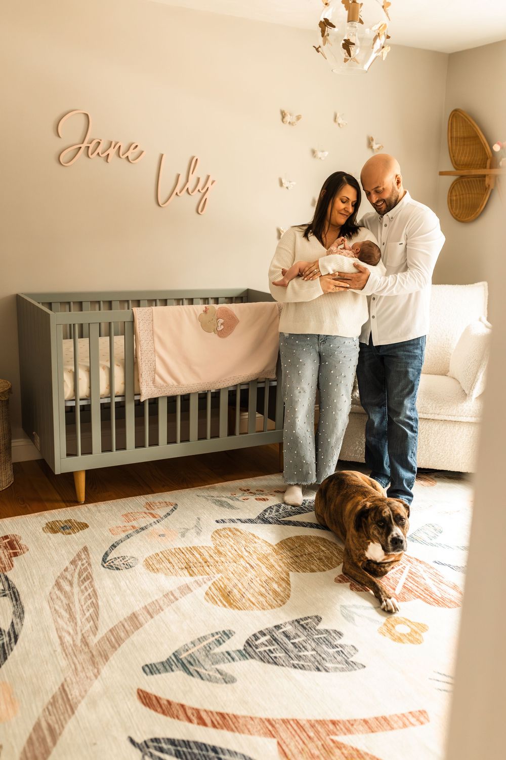 newborn photography at home session couple snuggling new baby new nursery