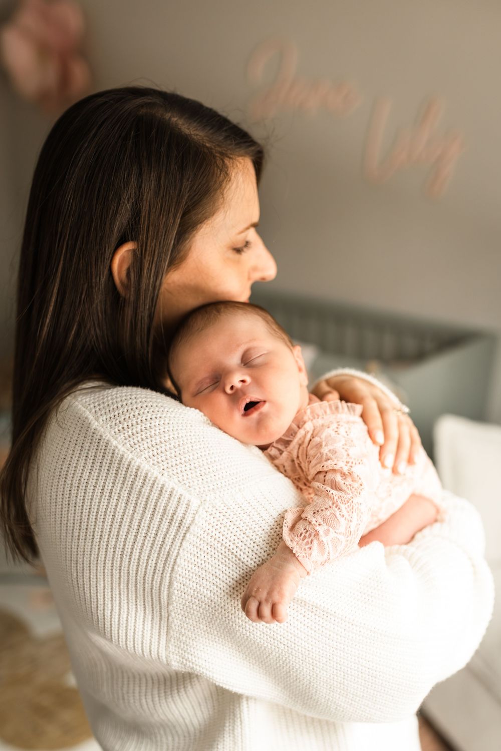 newborn photography at home session couple snuggling new baby