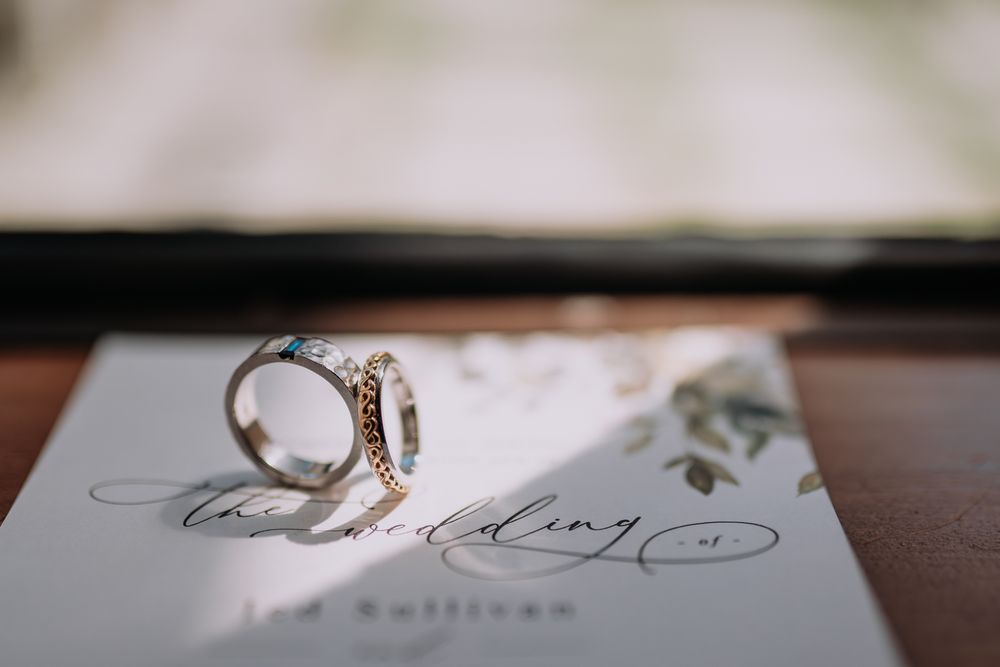 A close up detail shot of 2 wedding rings with sunlight overcasting taken by a Melbourne wedding photographer.