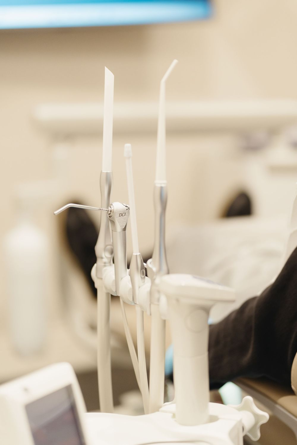 Close-up view of dental instruments arranged in a sterile medical setting.