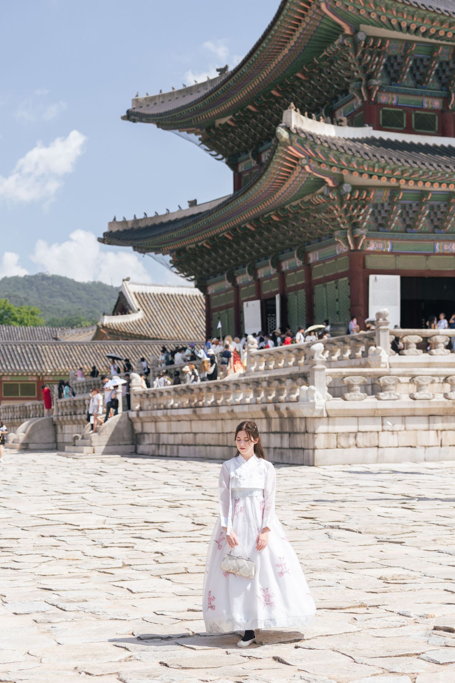 Traditional Korean palace architecture with ornate roofs and stone courtyard shown in a panoramic multi-image sequence.