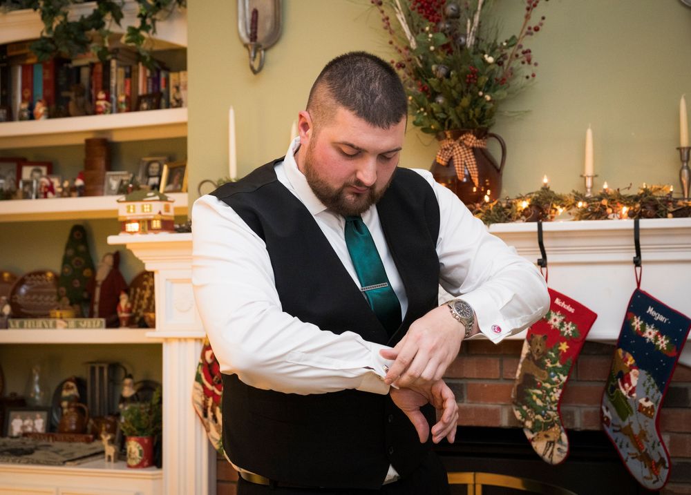 Wedding reception details showing holiday decorations and formal table settings.