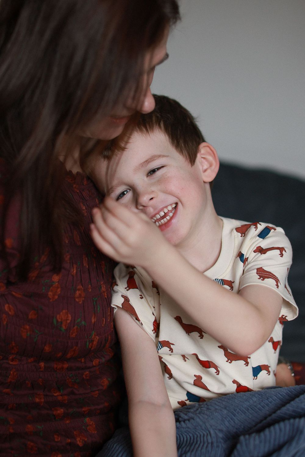 Intimate motherhood portrait captured in natural light during an in home portrait session in Brighton