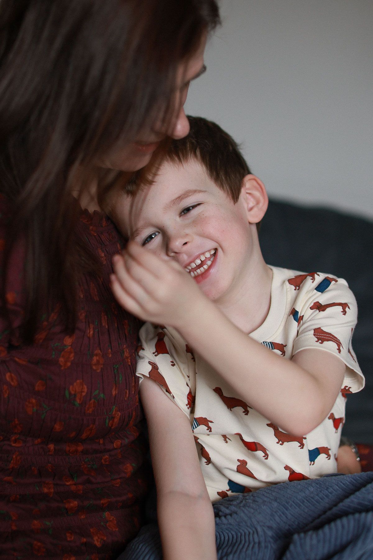 Intimate motherhood portrait captured in natural light during an in home portrait session in Brighton