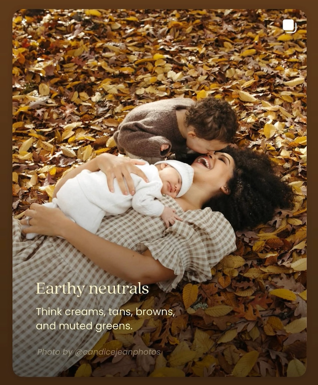Sioux City, Iowa photographer.Family lying in fallen autumn leaves, wearing earthy neutrals like creams, tans, browns, and muted greens.