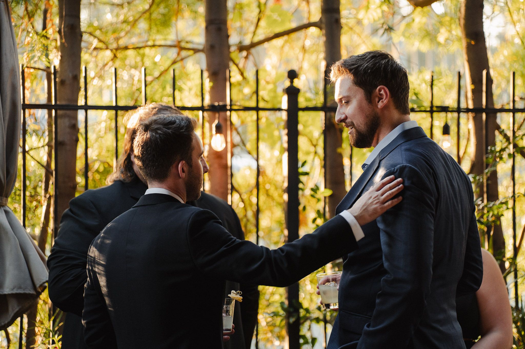 Documentary style photo of family chatting during a Pasadena wedding reception