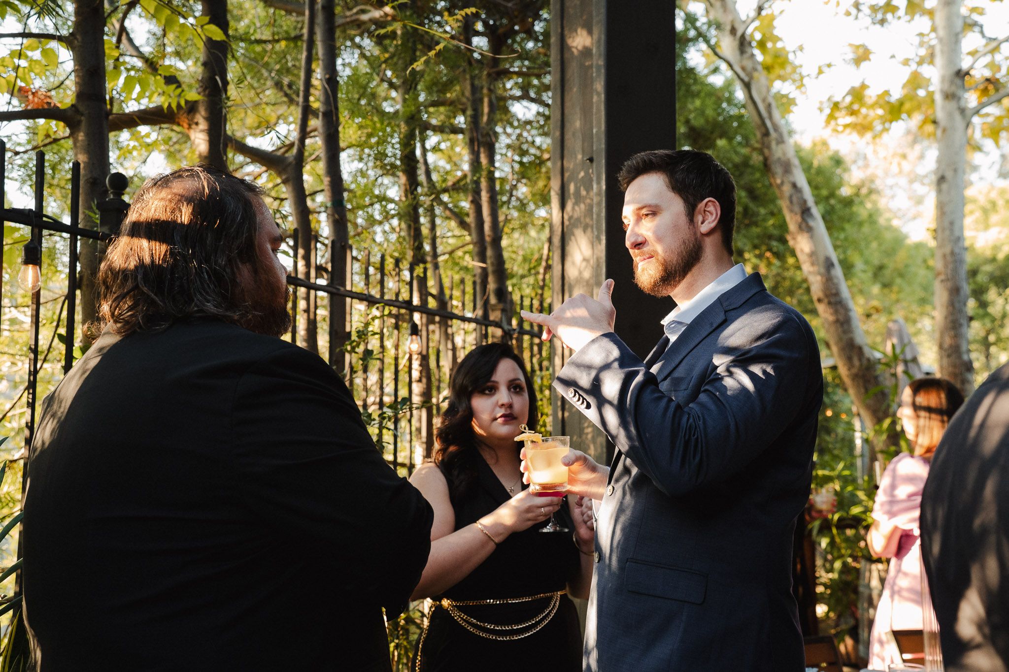 Warm evening light on guests during an intimate California wedding