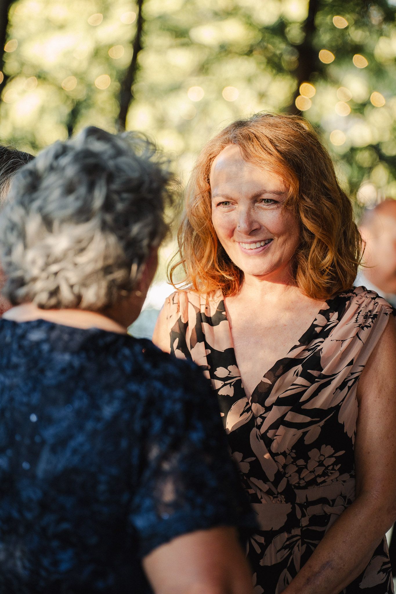 Guests laughing together during a warm Pasadena wedding reception