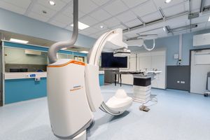 Modern medical imaging equipment and scanning machines in a clean hospital radiology department.