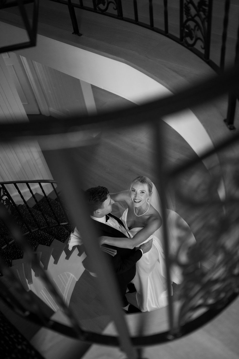 Artistic black and white staircase photo with dramatic shadows and architectural elements.