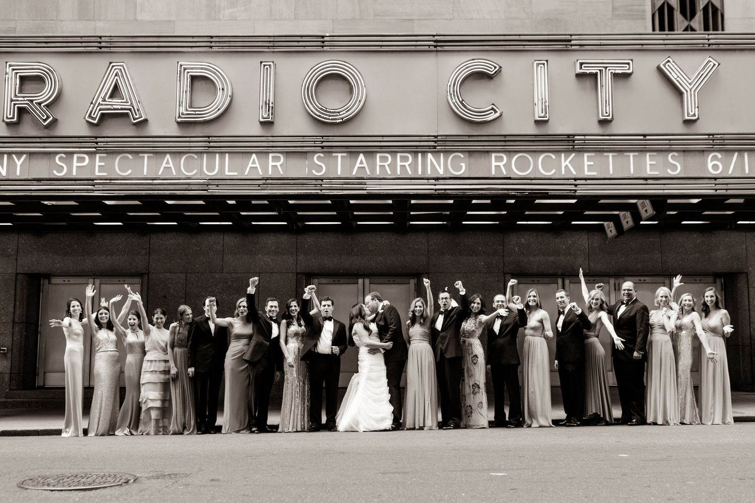 Vintage black and white photo showing the iconic Radio City Music Hall marquee and entrance in New York City.