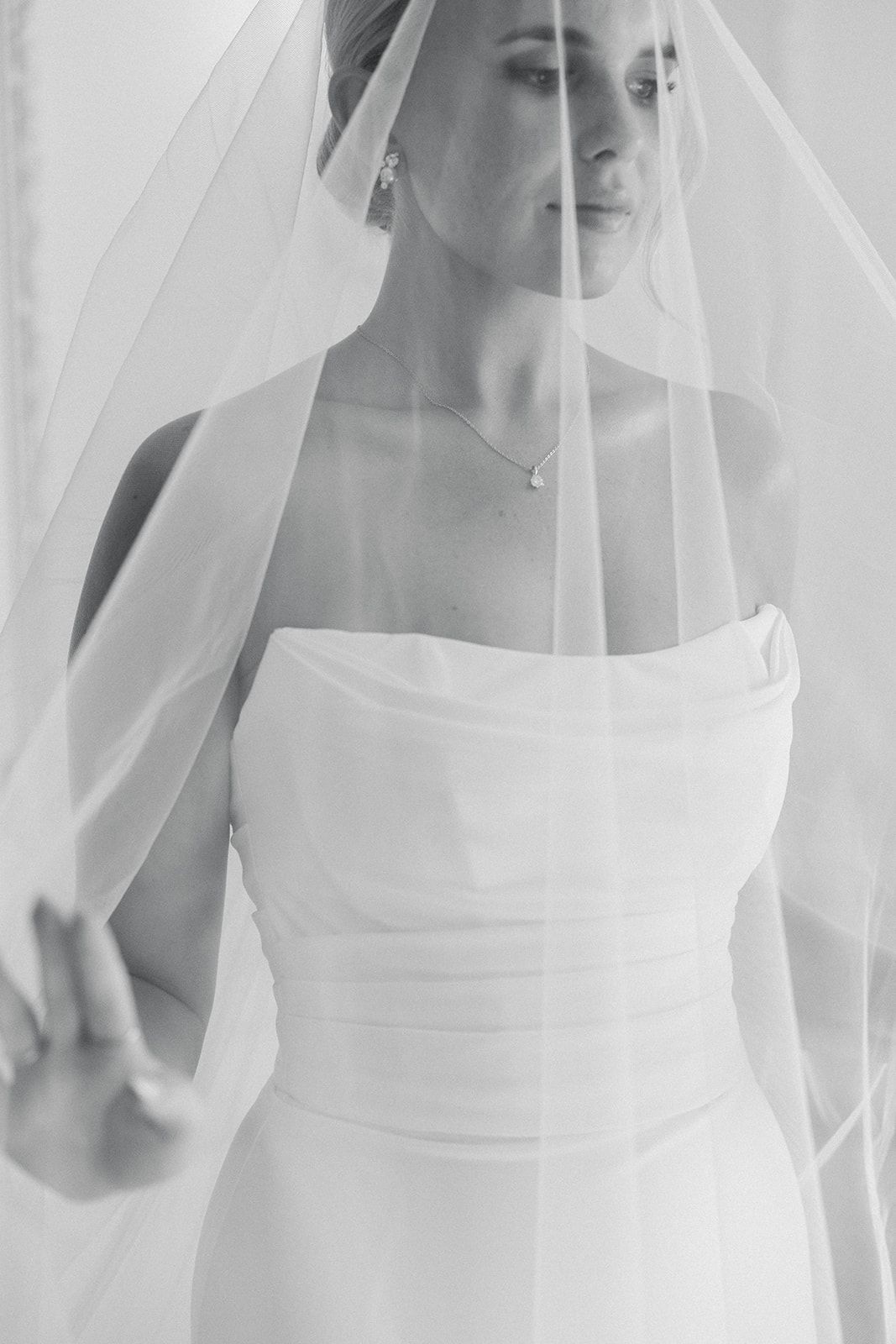 A series of elegant bridal portraits showing a white wedding dress and flowing veil in soft, ethereal lighting.