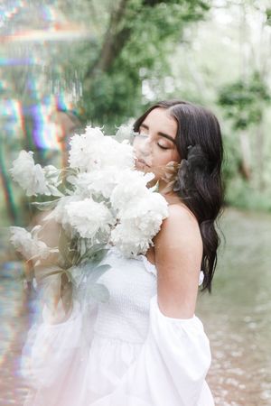 Artistic photo sequence showing white smoke or vapor being exhaled in an outdoor nature setting.