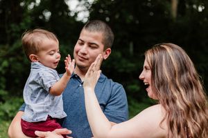 A series of candid outdoor family photos showing joyful moments and laughter in a natural setting.