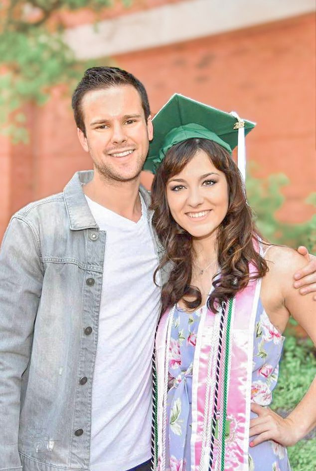 Brother and sister celebrate her accomplishing her masters degree.