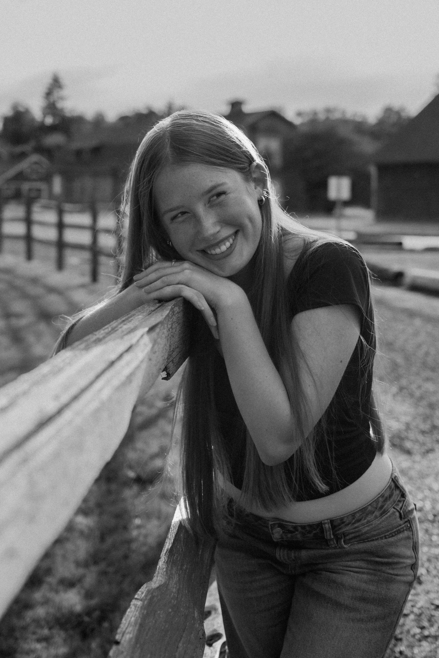 Black and white outdoor portrait session with candid laughing moments.