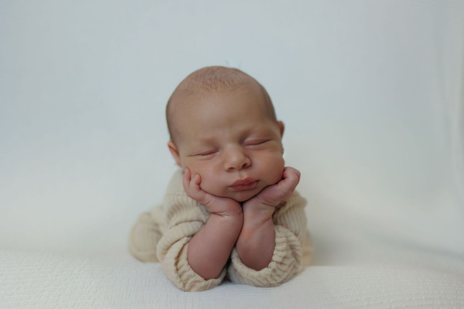 Peaceful newborn portrait captured during a twin newborn photography session in Michigan studio