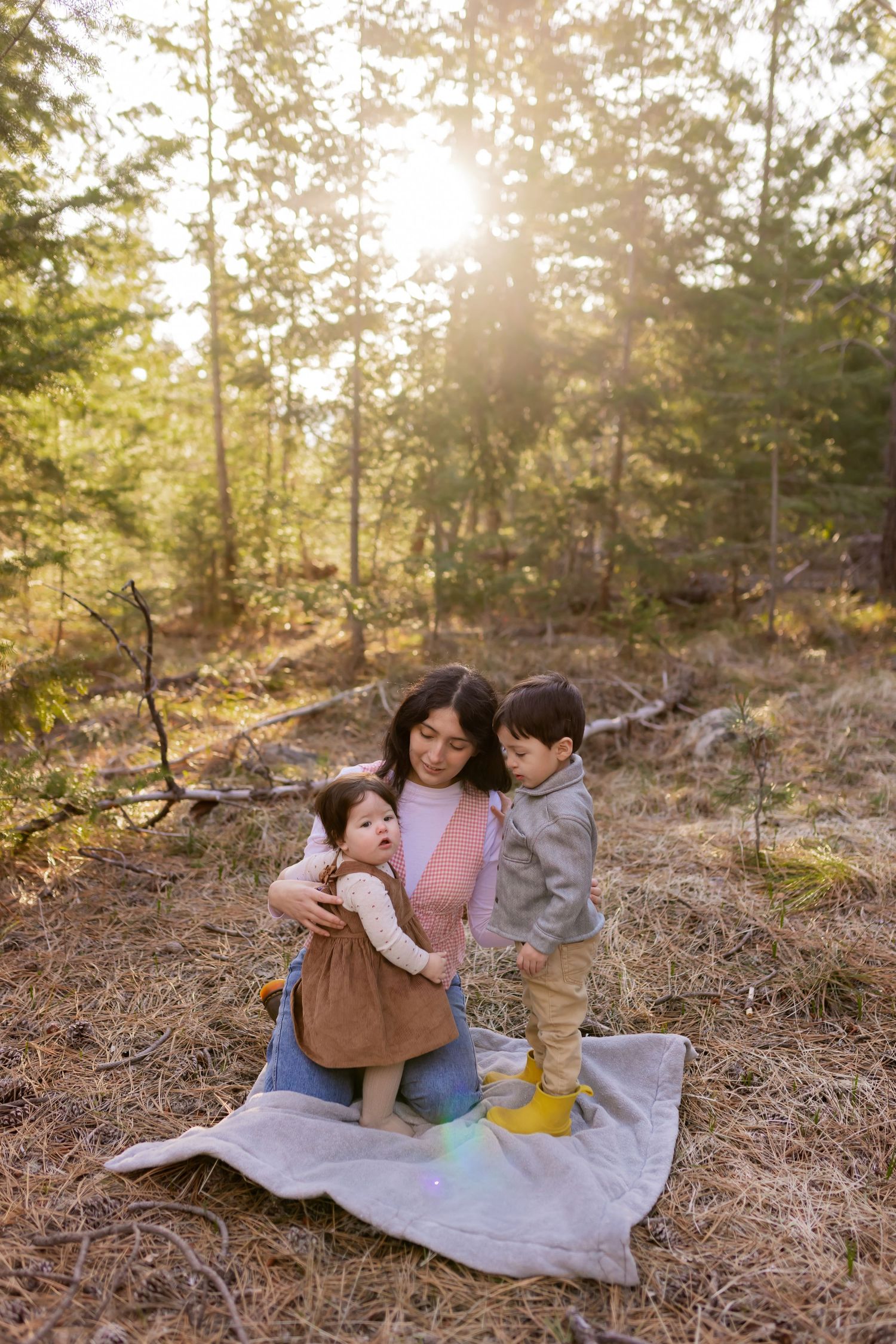 Mother holding her children during an outdoor family photography session in Montana