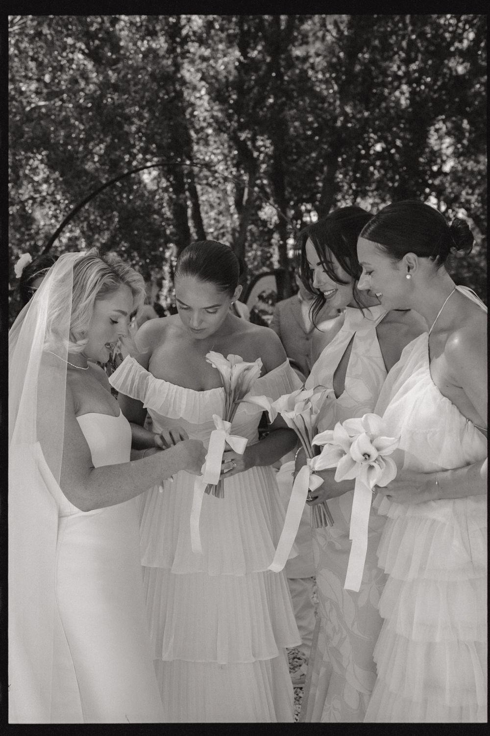 A sequence of three photos showing bridesmaids in white dresses leaning in towards each other in a playful group pose.
