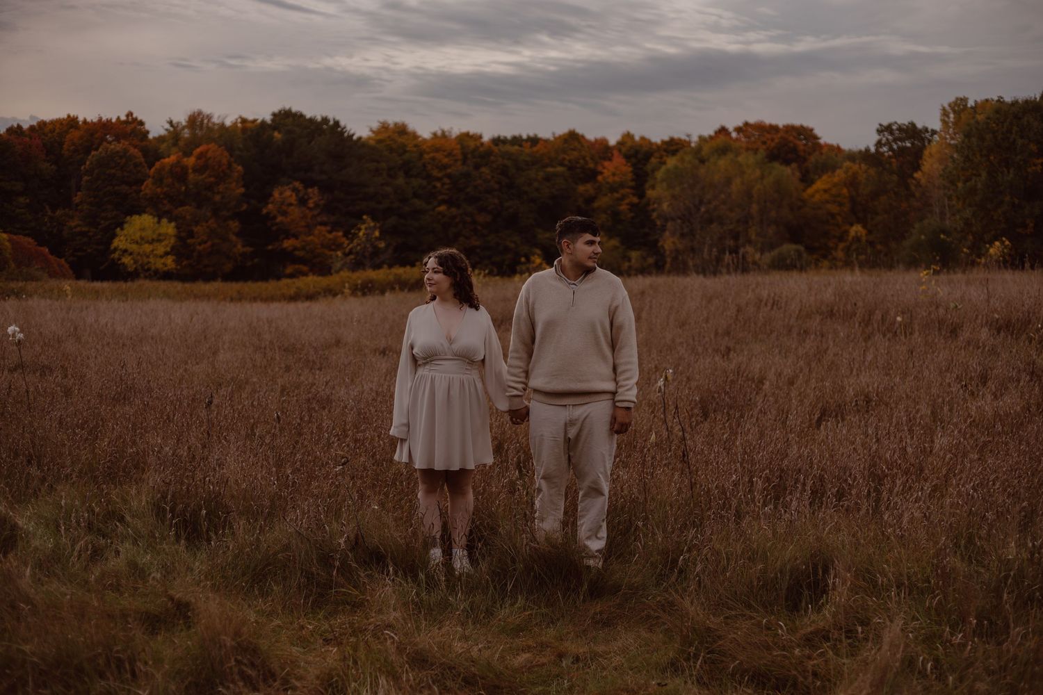 Engagement session during the fall. surrounded by beautiful fall colours while the couple is neutral. Burlington, Ontario
