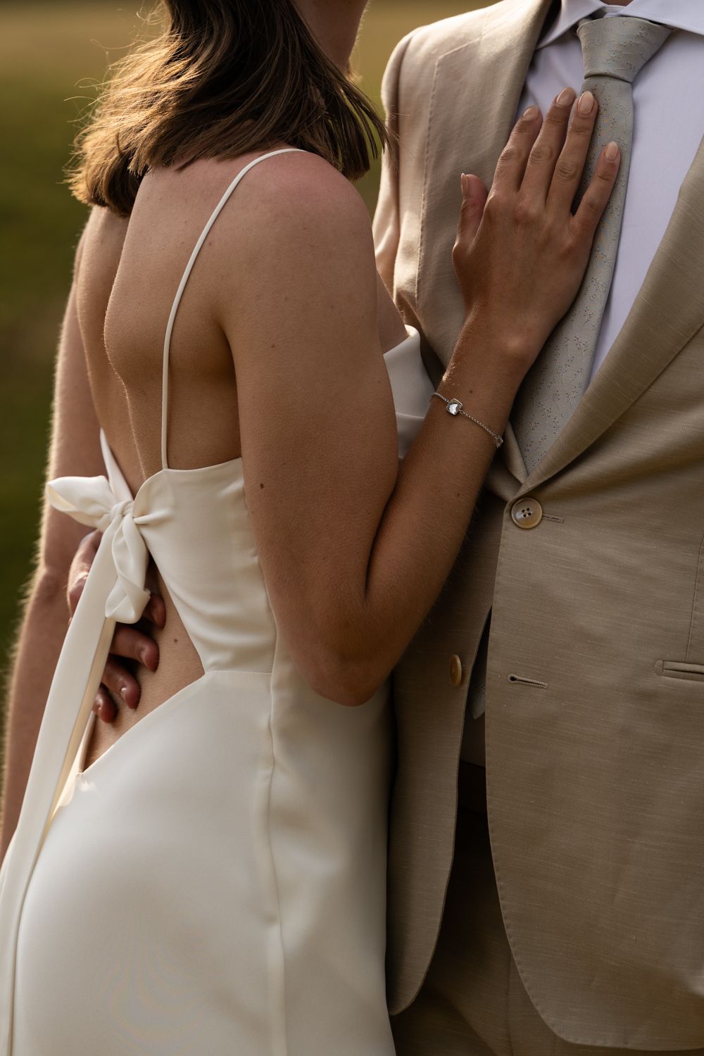 A series of romantic wedding photos showing intimate close-up moments between a couple in formal attire.