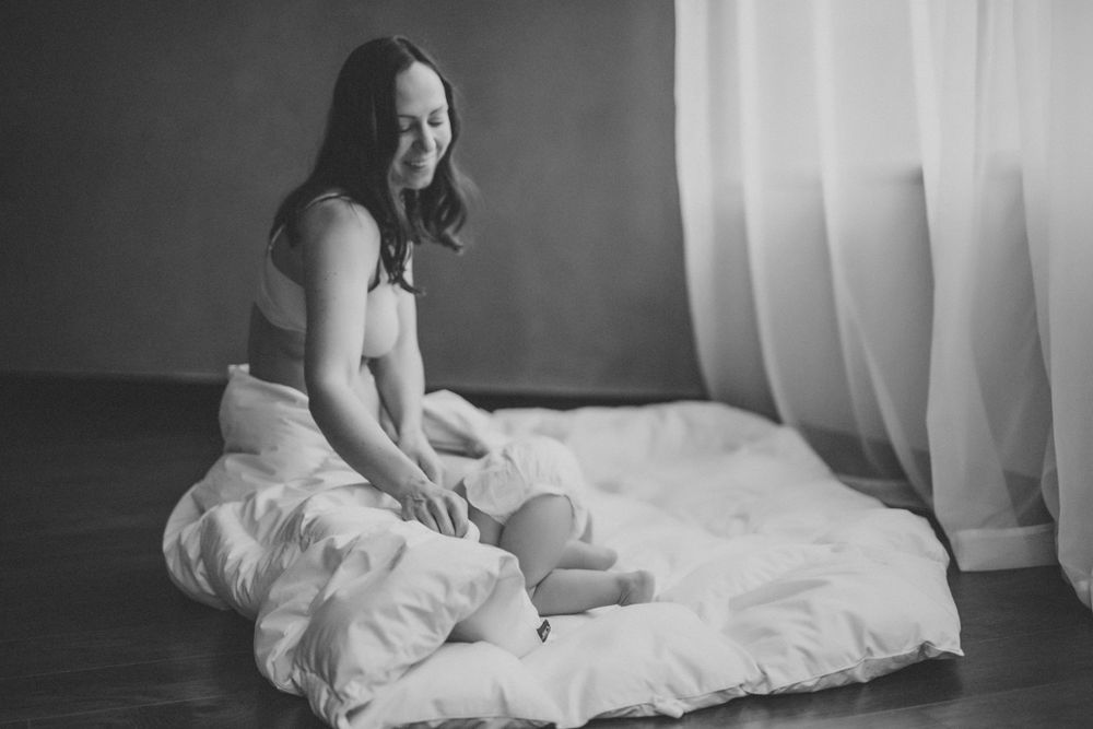 Tender maternal moment in black and white.