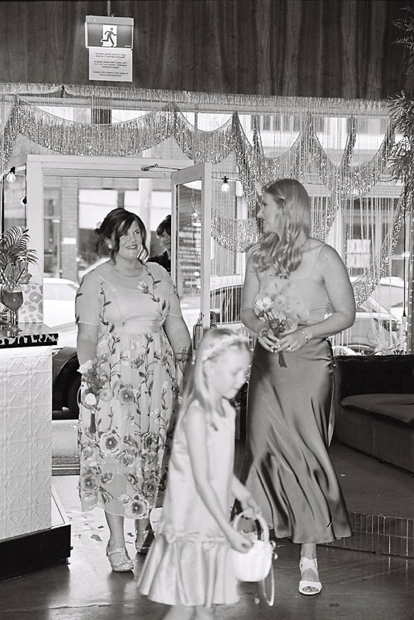 Vintage black and white photo sequence showing people dancing in a social setting.