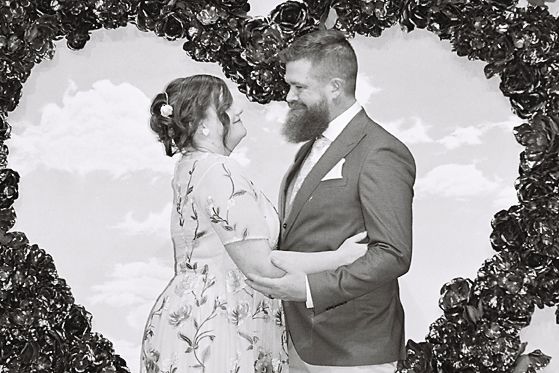 Black and white wedding photo collage shows couple embracing outdoors surrounded by tree silhouettes.
