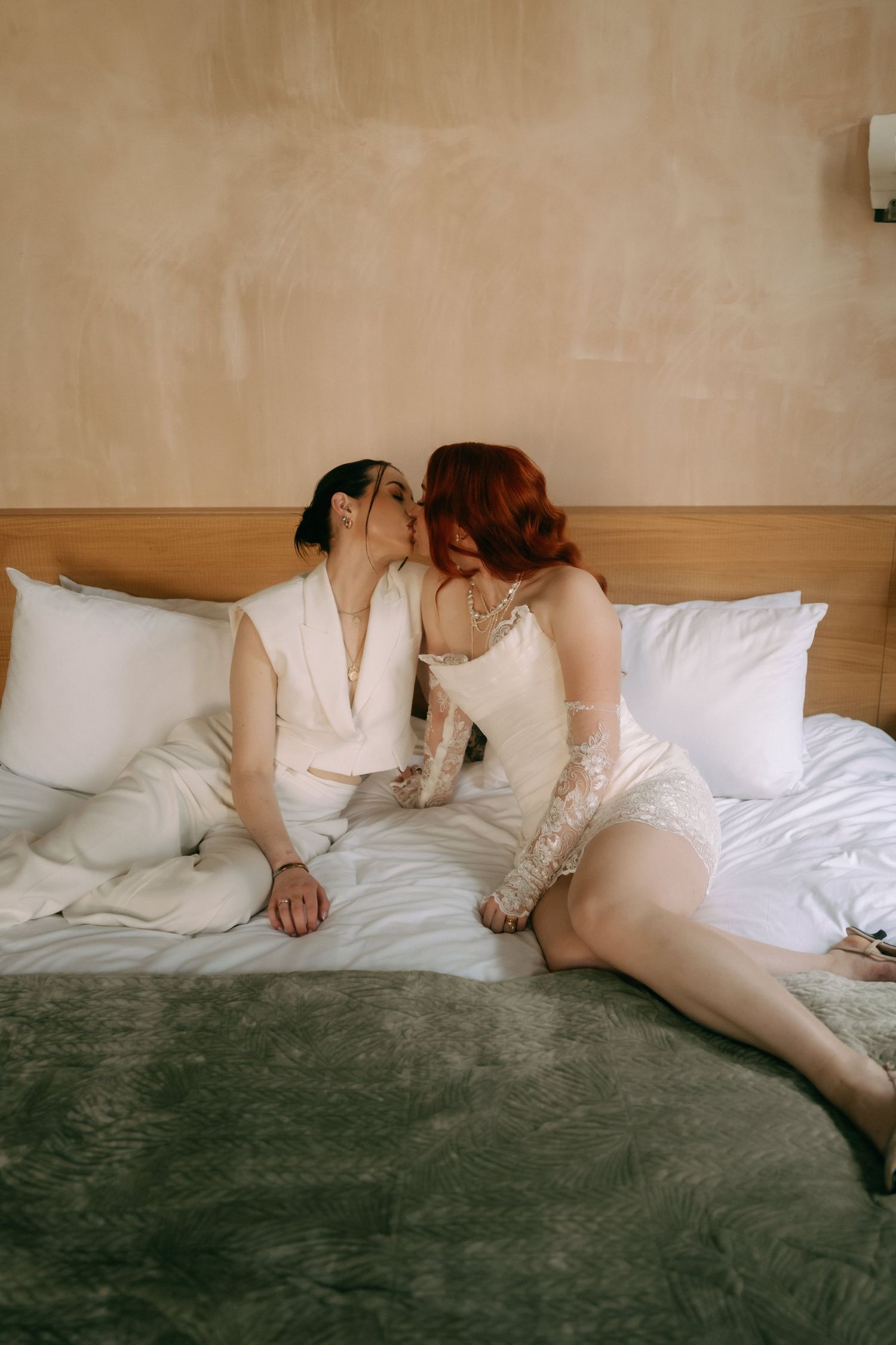 A series of cropped photos showing someone lying on a bed with white sheets and dark green carpeting.