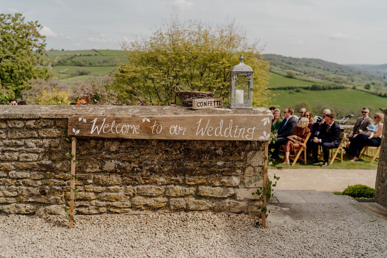 Stone wall with countryside view at an outdoor wedding venue location.